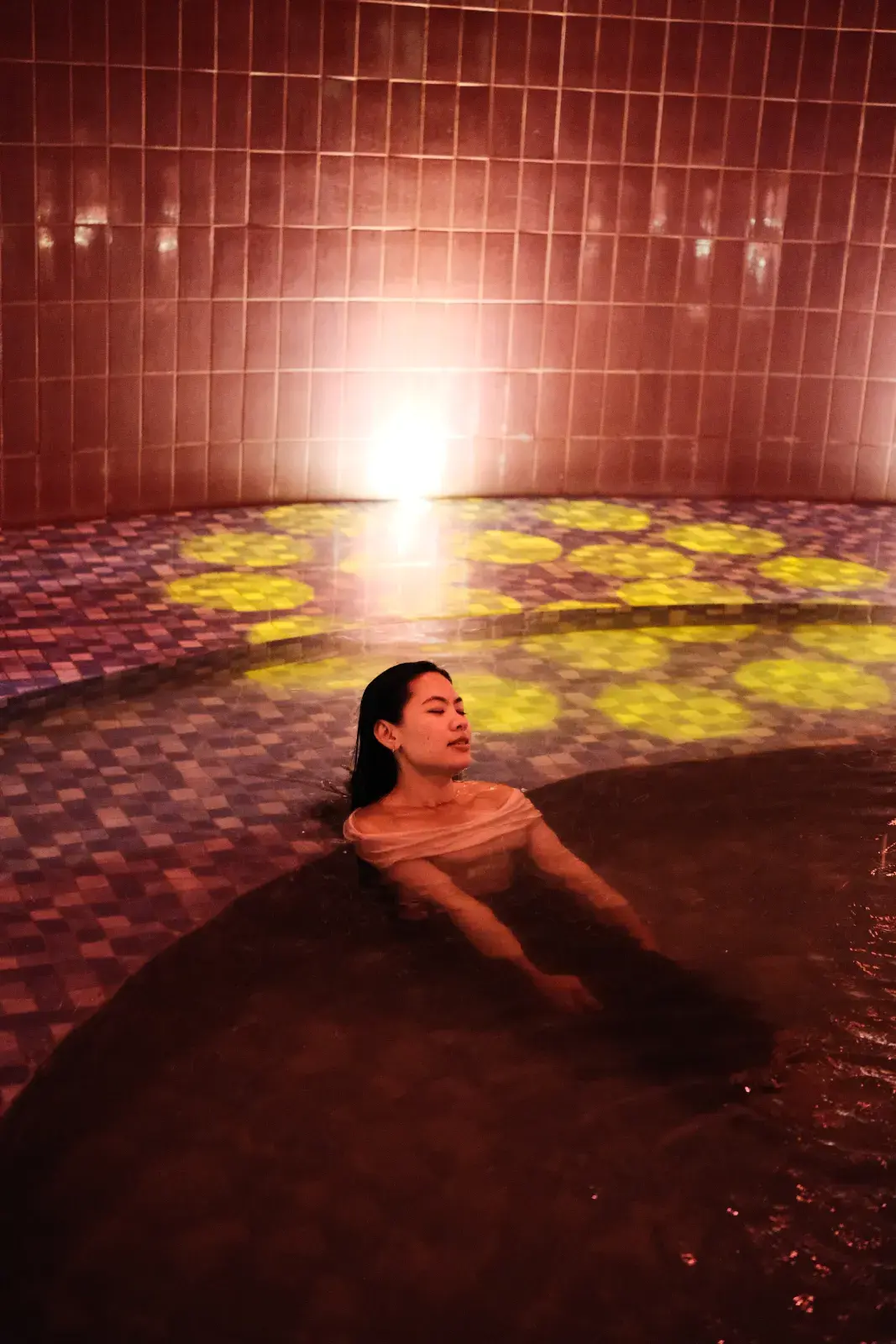 Guest soaking in a warm Jiwanta mineral bath